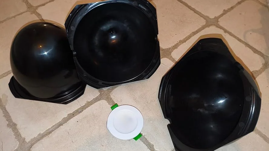 Customer photo: three CX5 covers, one flipped with an LED spot